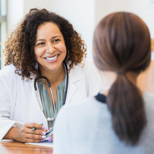 Lady Doctor Consulting patient with smile