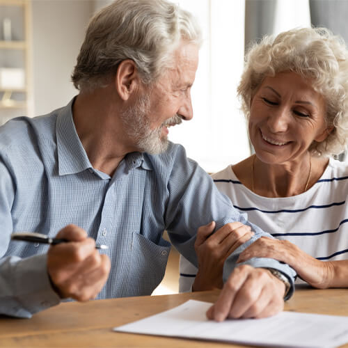 A old Couple Filling the form before surgery